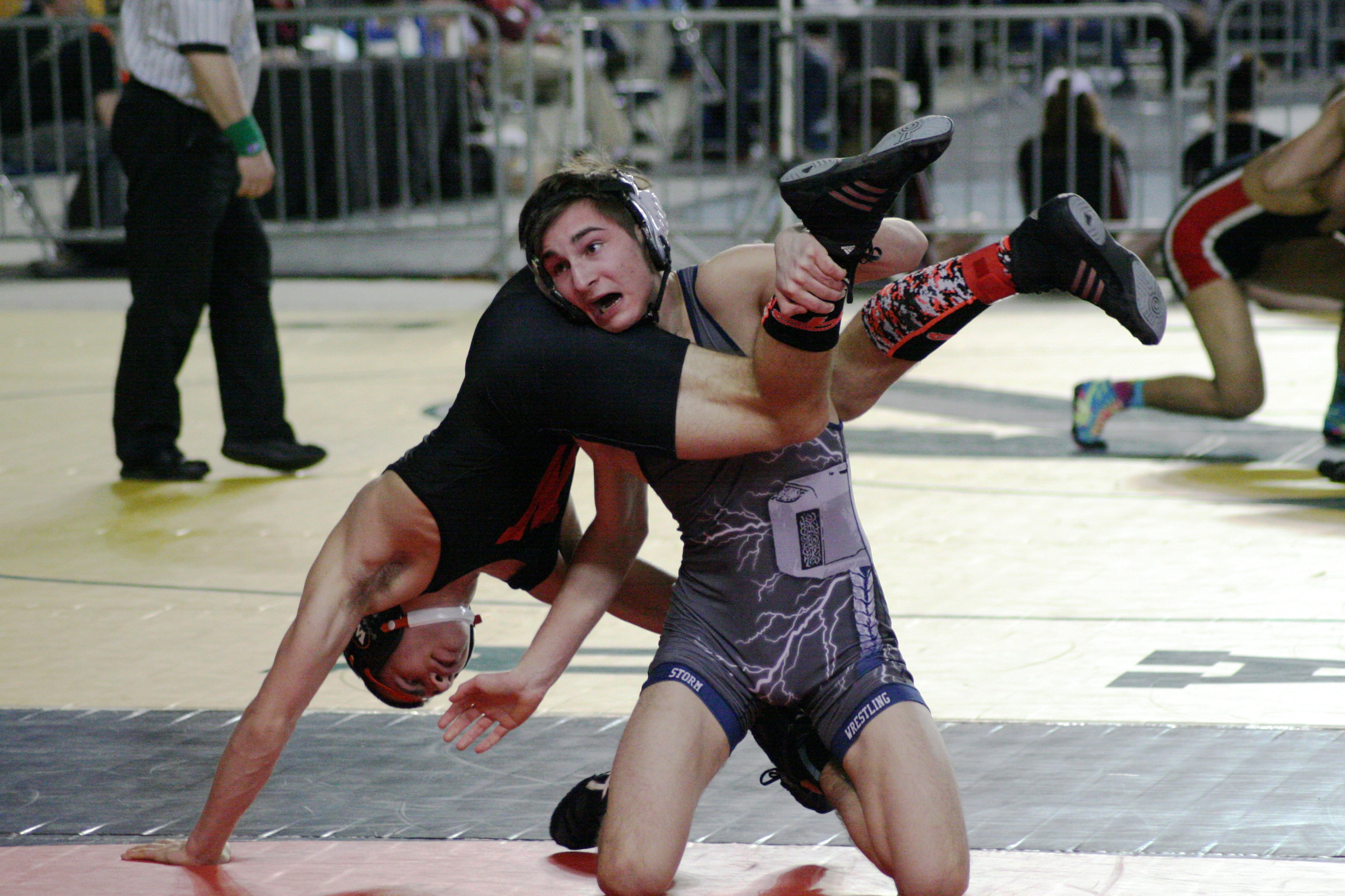 Head scissors handstand by AJ Christianson.