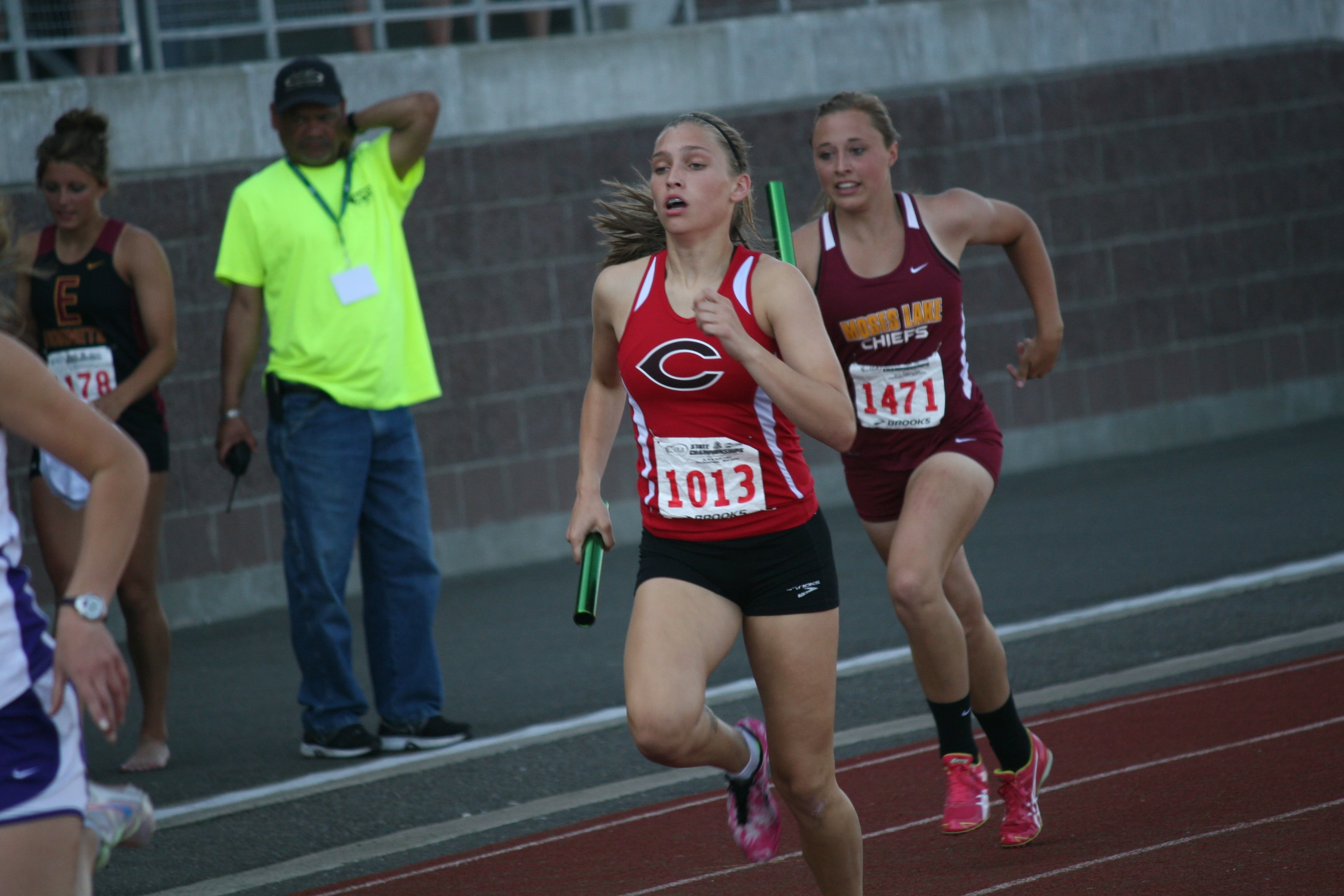 Meghan Finley picks up the pace for the Papermakers in the third leg of the 1,600 relay.