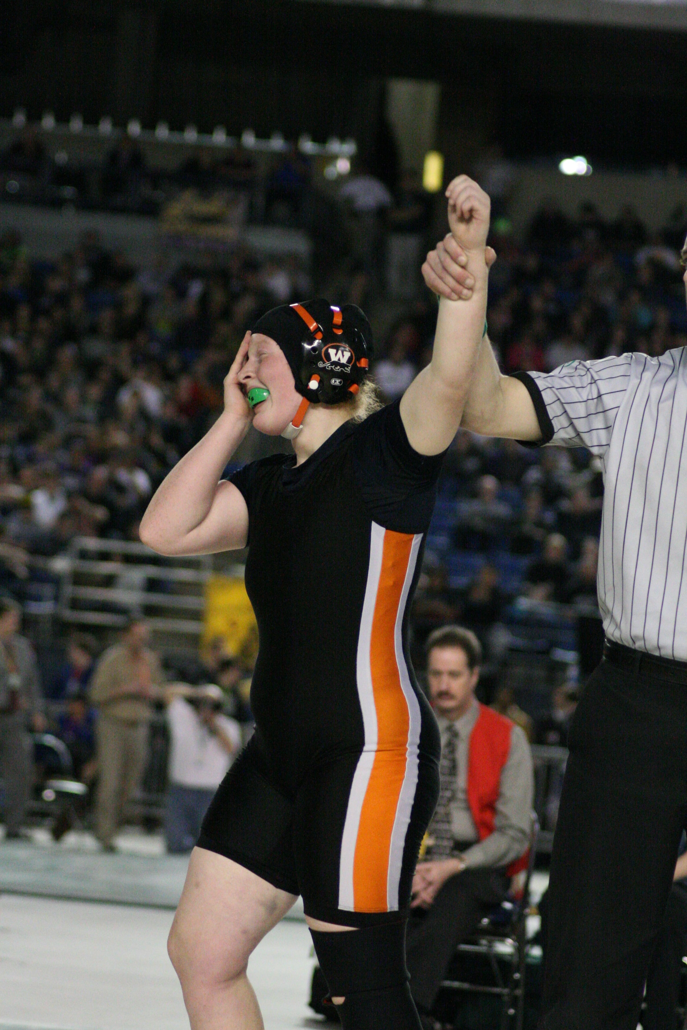 Abby Lees cries tears of joy after reaching the top of the podium at the Tacoma Dome.