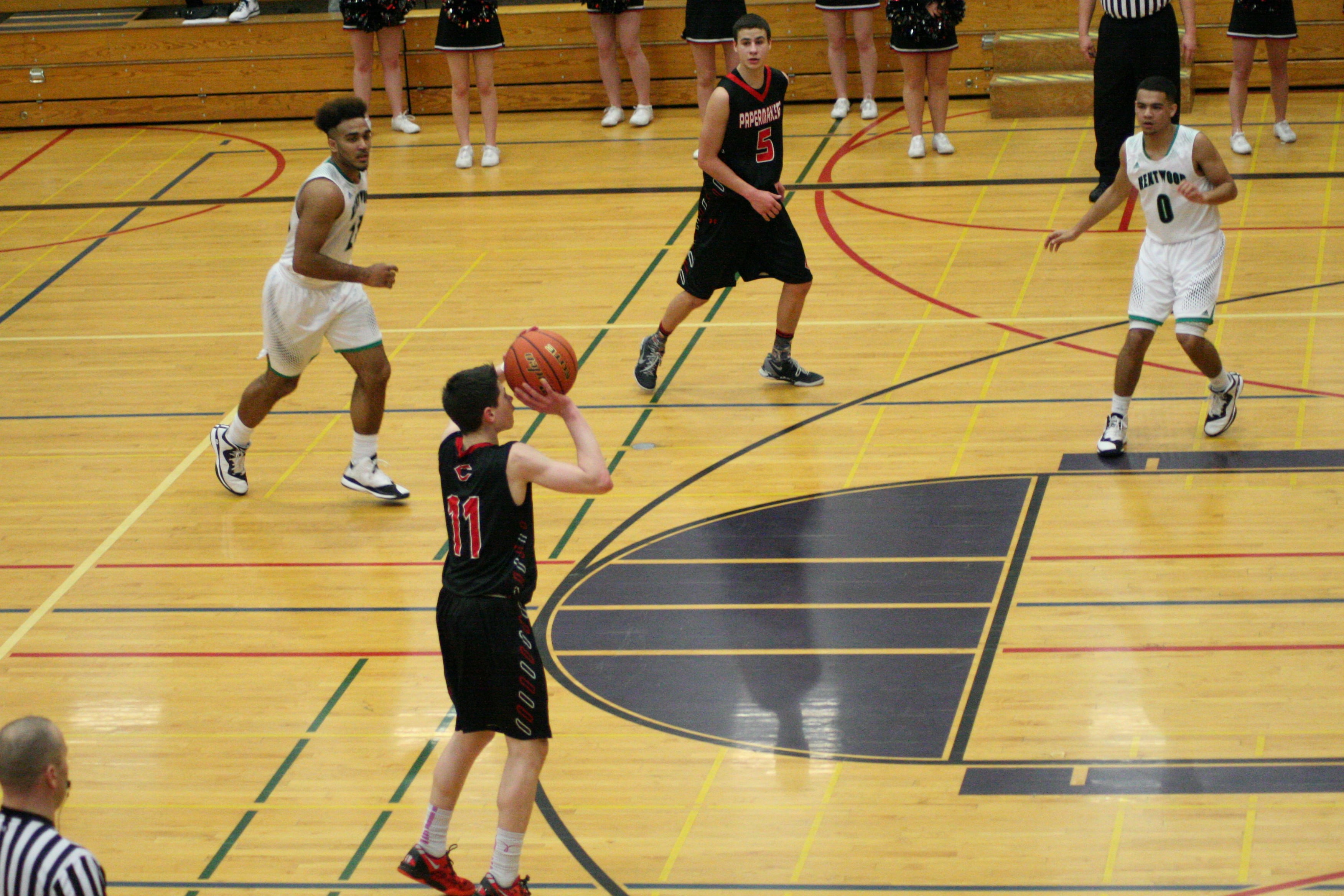 Ethan Unger releases a huge 3-pointer to bring Camas within two points of Kentwood during the final minute of play.
