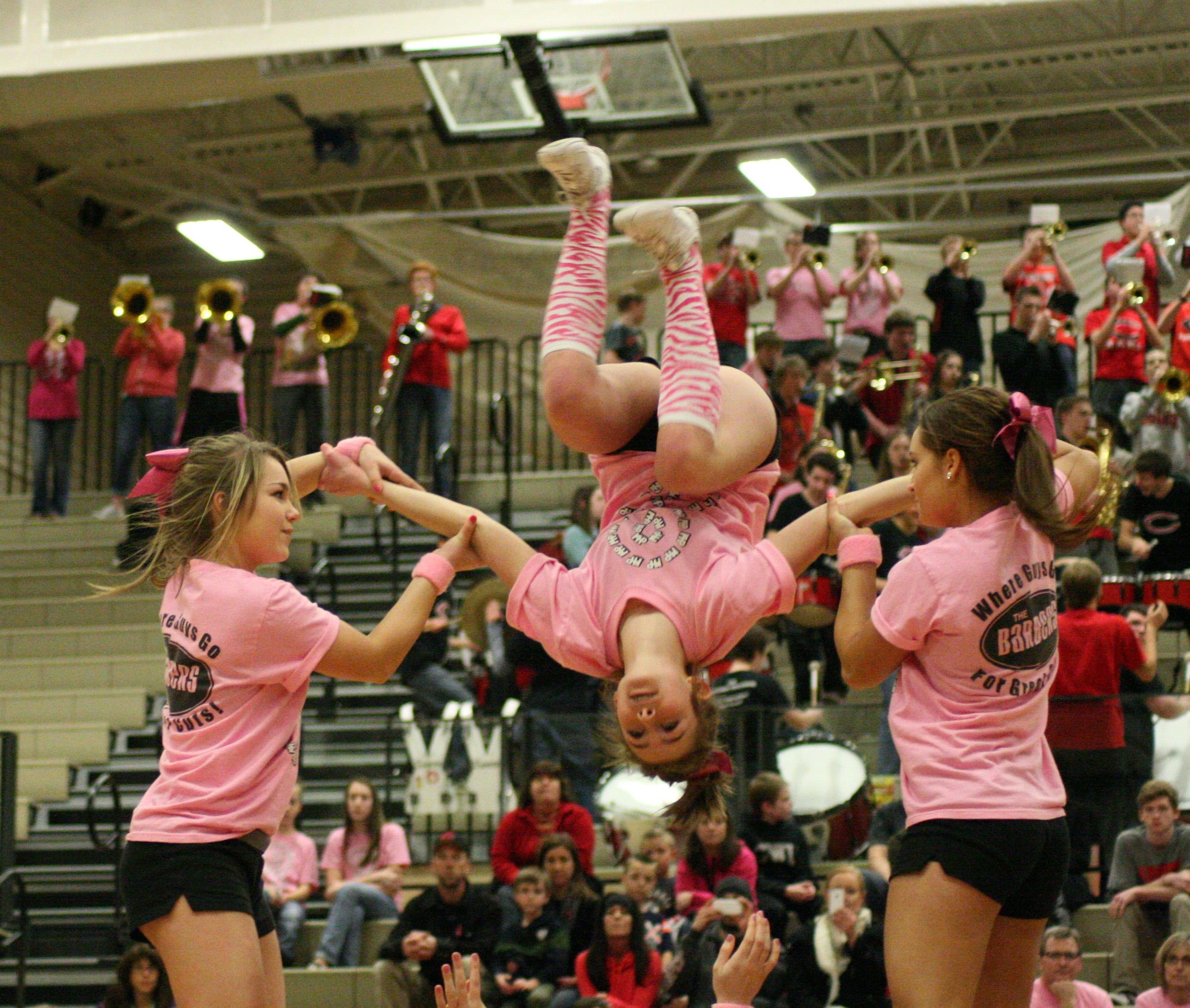 The Camas cheerleaders pulled off some big time stunts on Hoops for Pink night.