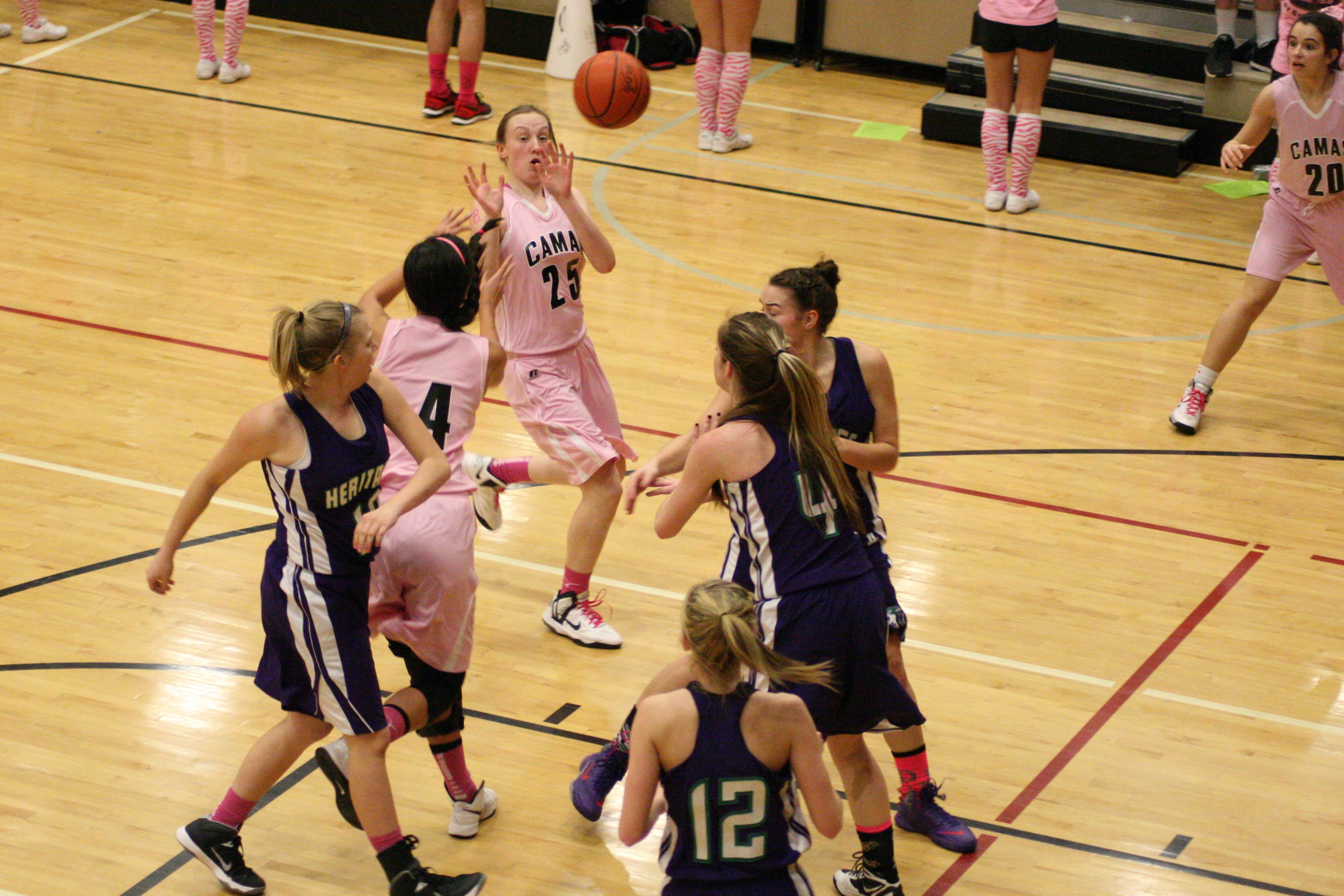 Brenna Khaw feeds Emma Jones on the break. This was one of Khaw's eight assists in the game.