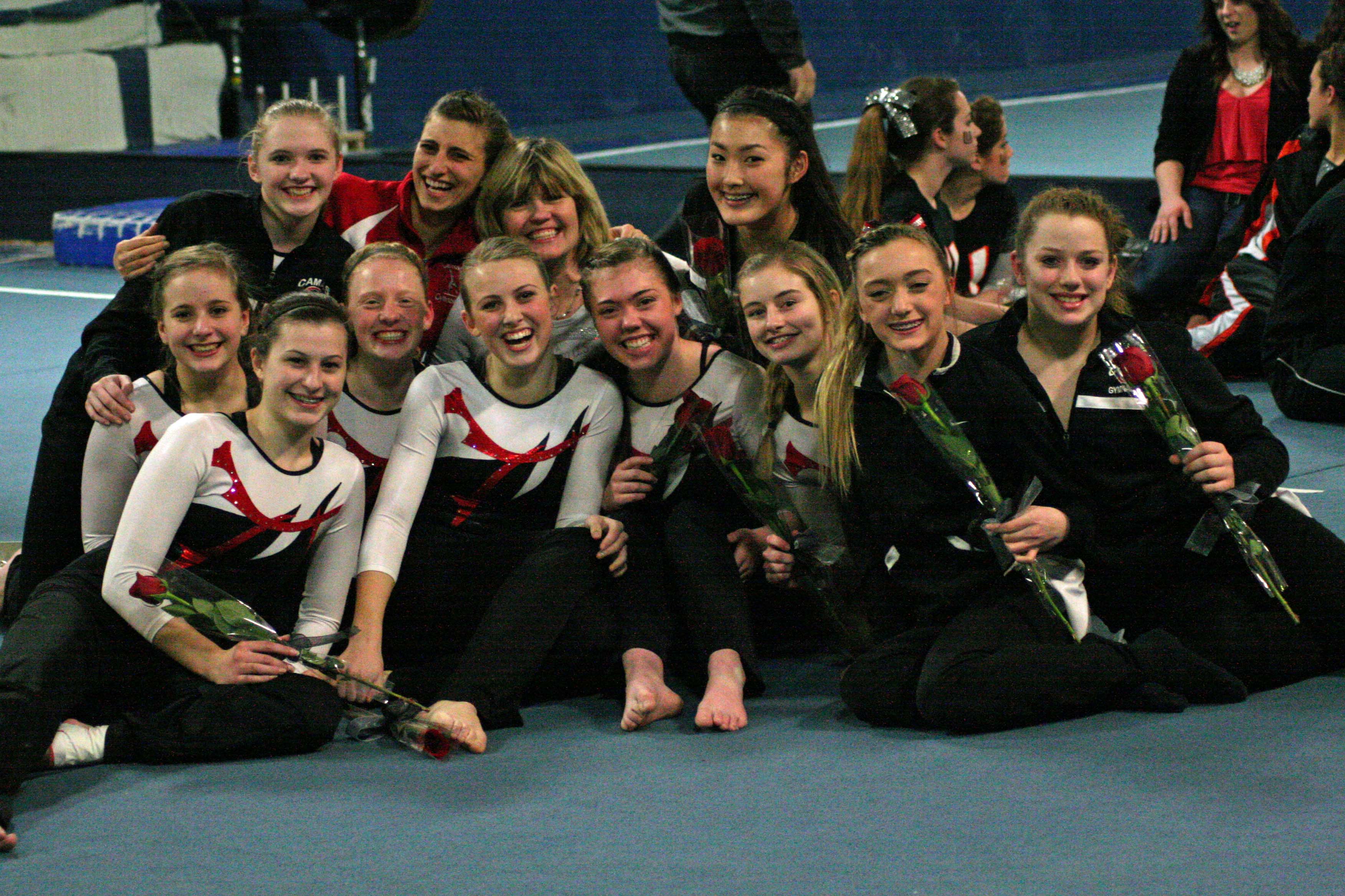 The Camas High School gymnasts and coaches are all smiles after becoming district champions, at Northpointe in Vancouver.