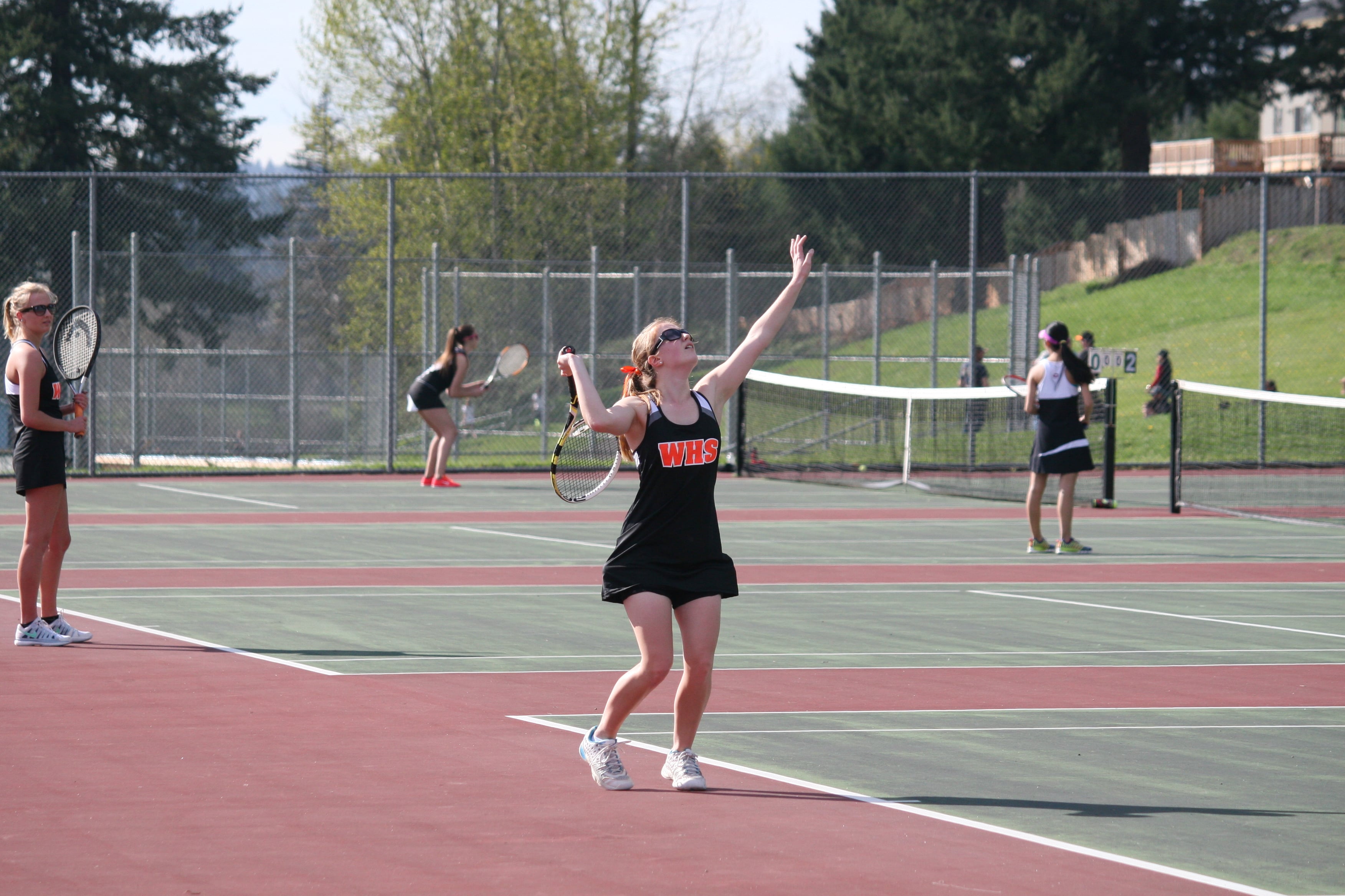 Maddie Gregory serves for Washougal.