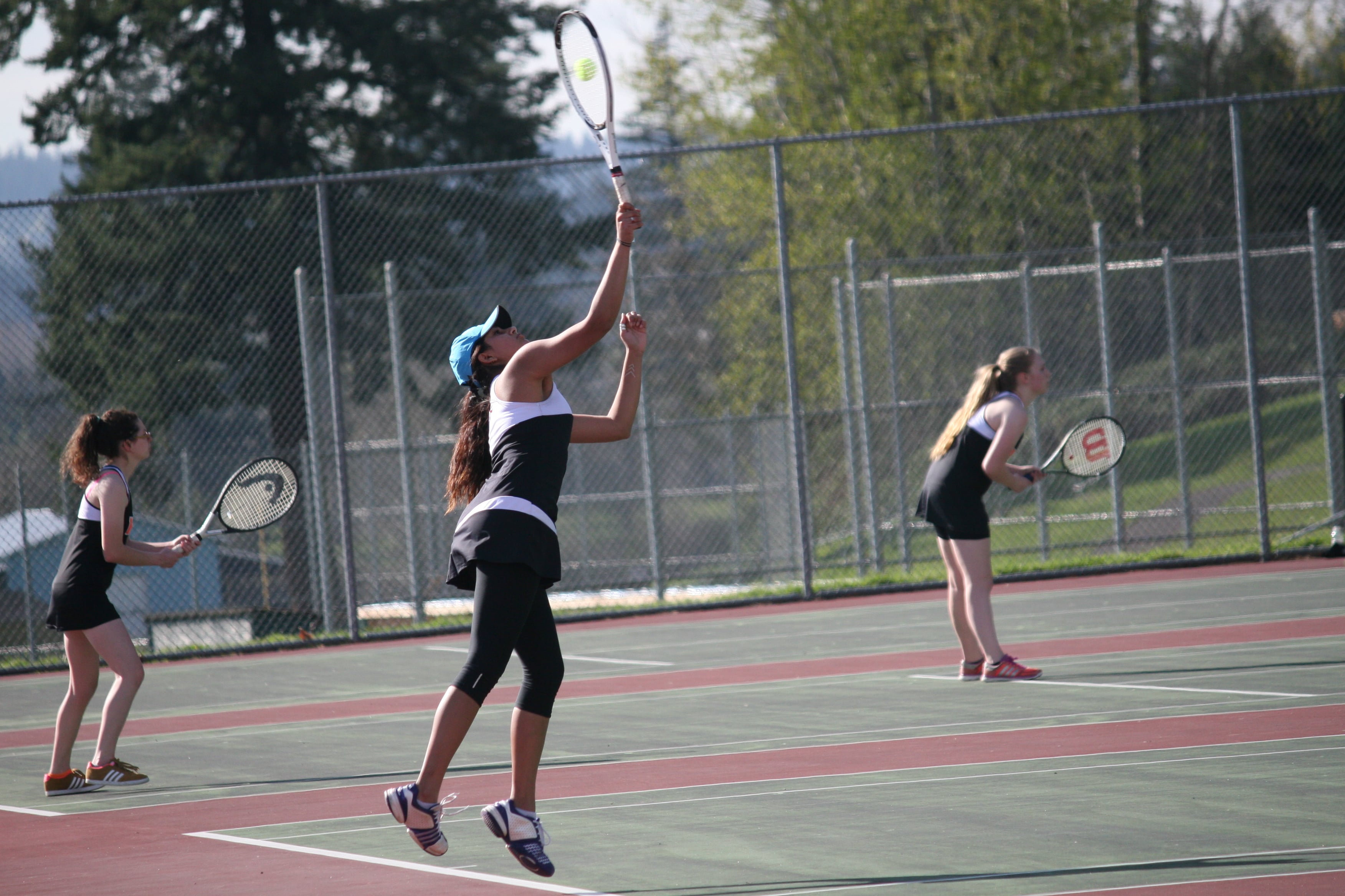 Meghal Sheth smashes serve for Camas.