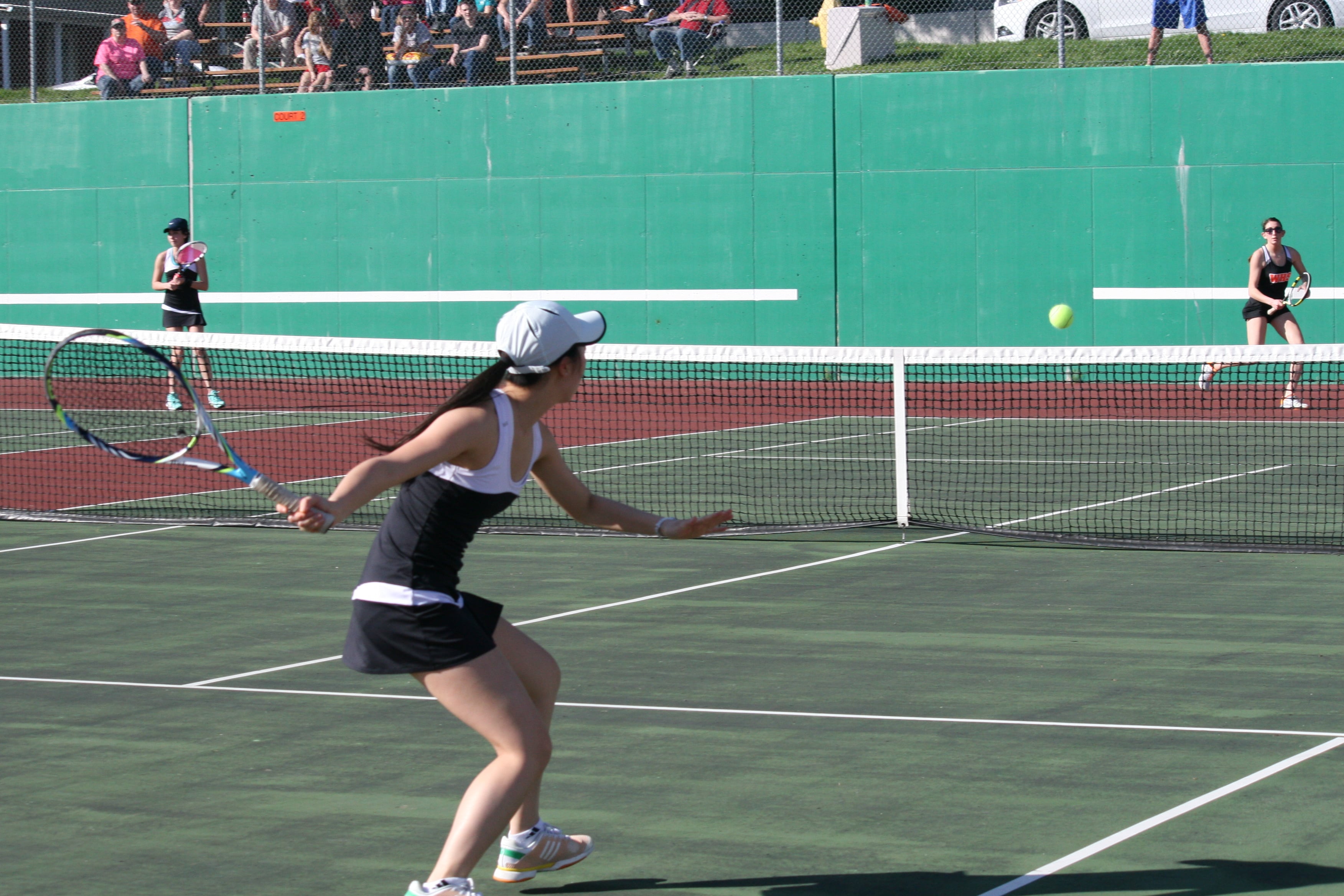 Cross court battle between Camas High School senior Esther Kwon and Washougal High School senior Haley Briggs.