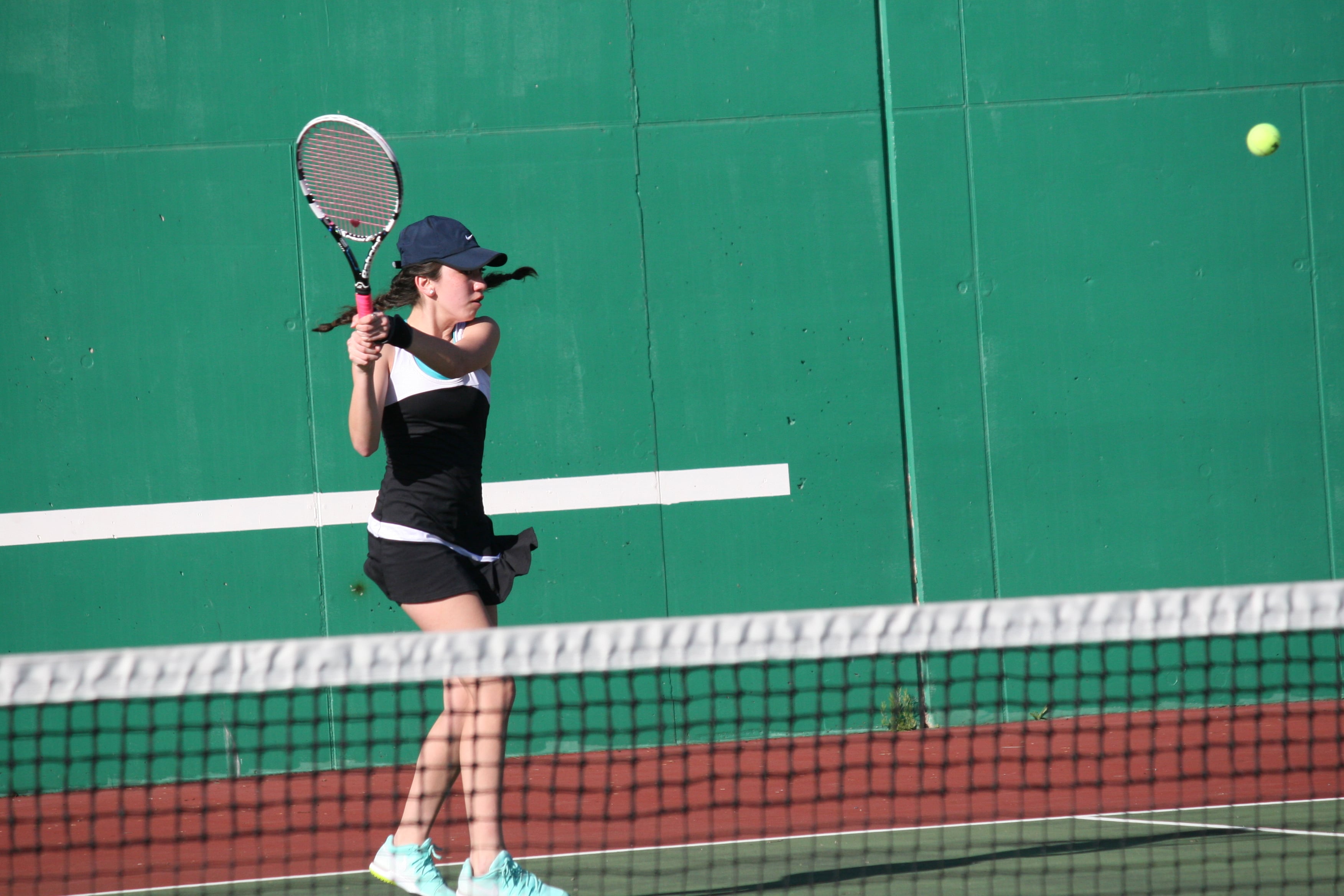 Samantha Merrill with a backhand for Camas.
