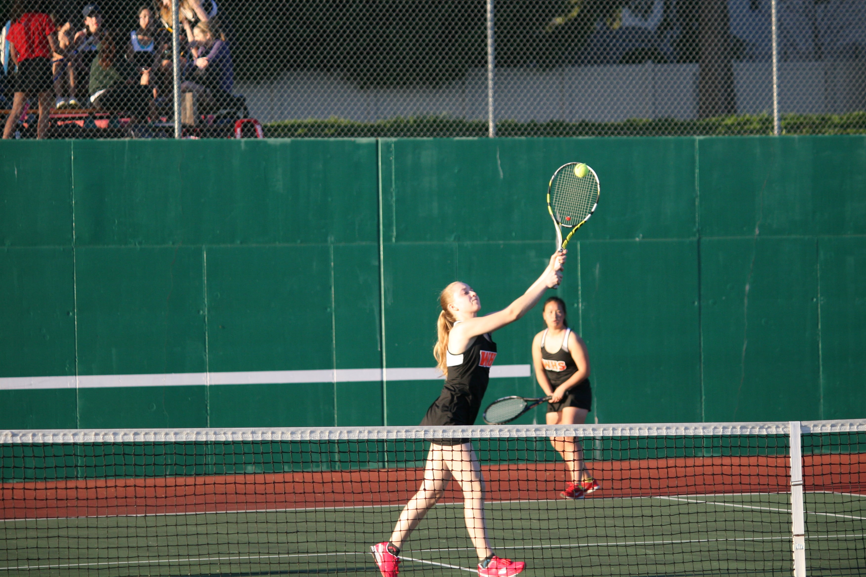 Jessica Eakins zeros in a smash at the net for Washougal.