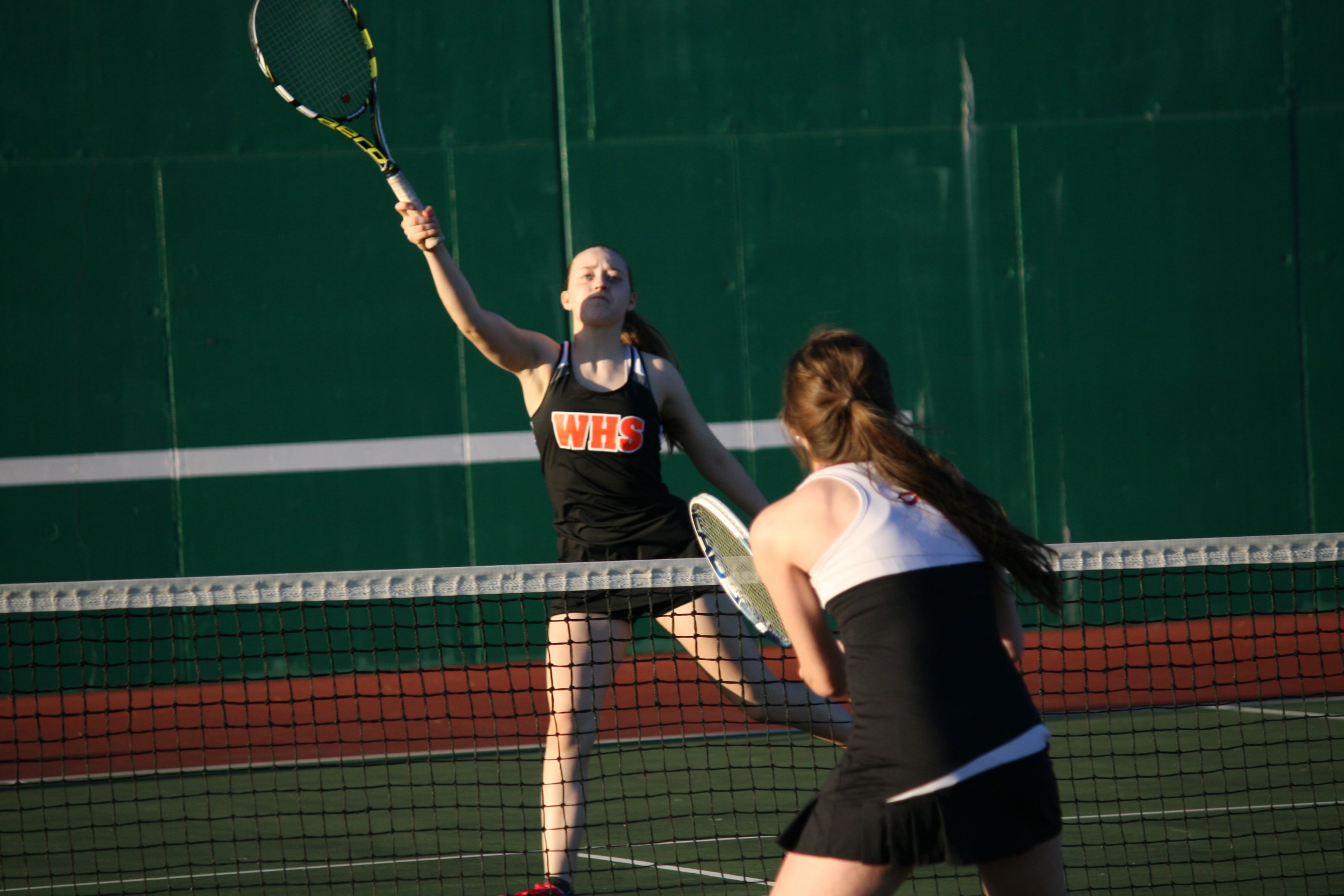 Jessica Eakins volleys the ball to Stephanie Schuldt.