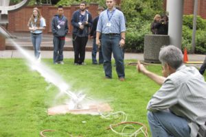 Keith Stansbury, head of the Clark College CAD/Engineering Applications department, helps students launch rockets during SEMI High Tech U last week. The program targets 14- to 17-year-old students who have an interest in high-tech fields.