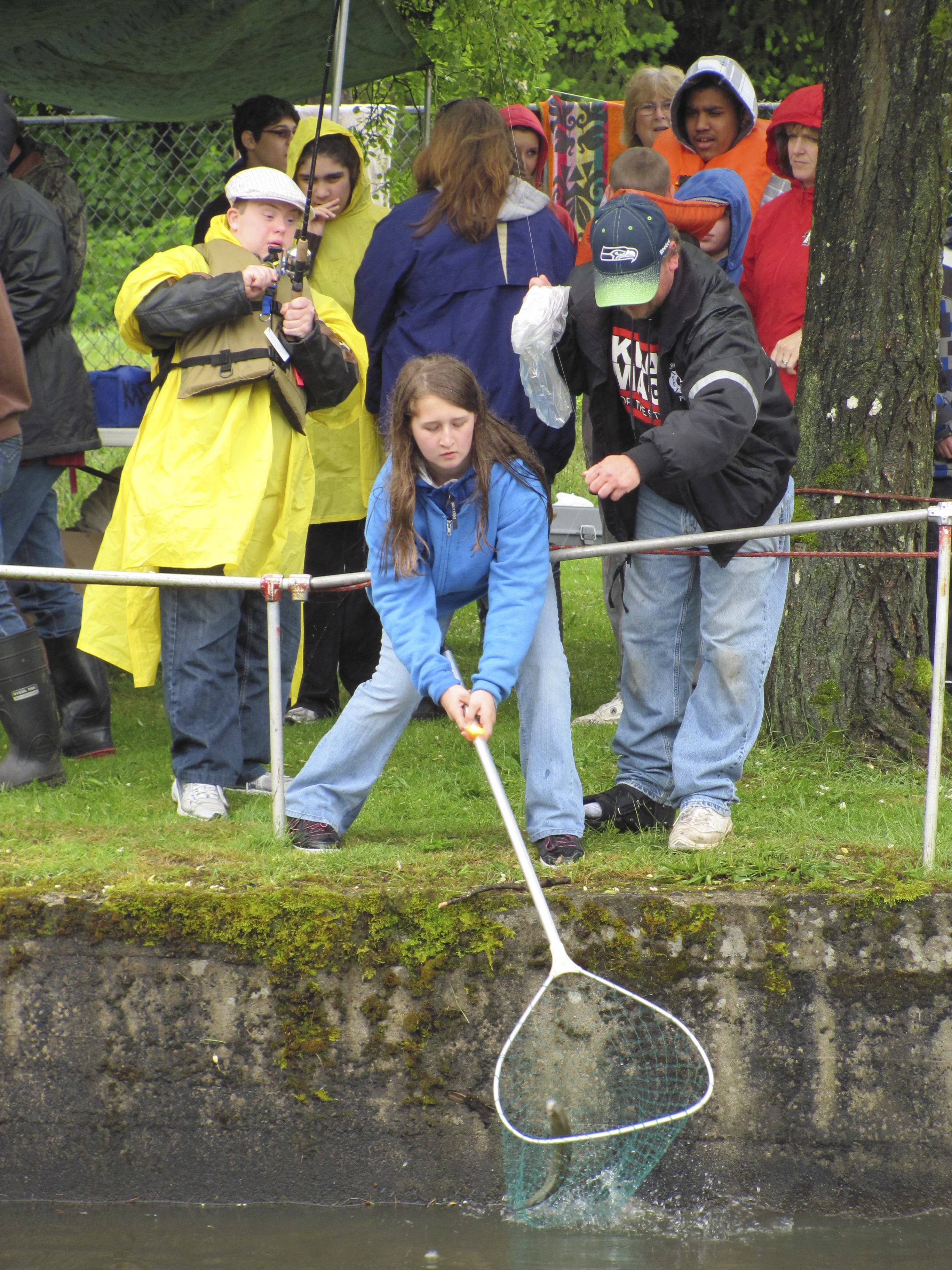 Once youngsters reeled in their catch, Moose Lodge volunteers helped snatch the fish from the water, remove the hook, then clean it.