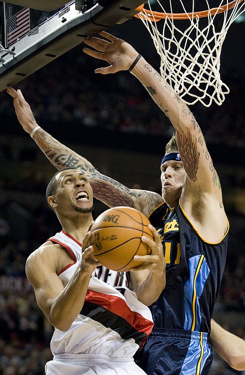 Steven Lane/The Columbian
Brandon Roy, left, drives against Denver's Chris Anderson. Roy finished with a team-high 30 points on Thursday. But it was not enough as Portland fell 97-94 to the visiting Nuggets.