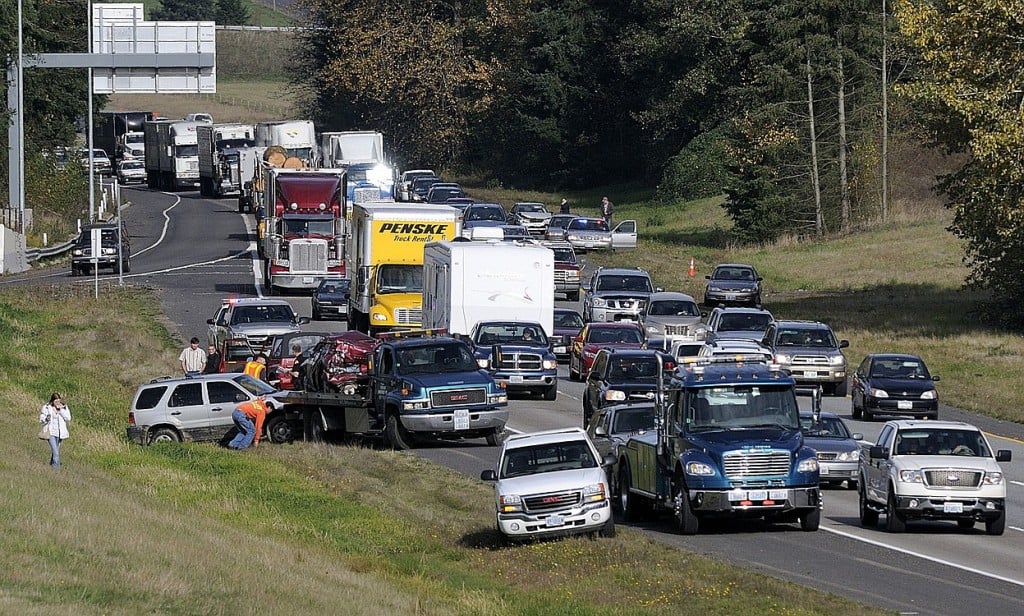 Troy Wayrynen/The Columbian
All three southbound lanes of Interstate 5 were closed Wednesday morning after a series of rear-end collisions. Three people were taken to a hospital, one with serious injuries, according to the Washington State Patrol.