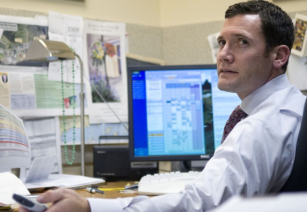 ZACHARY KAUFMAN/The Columbian 
Apparent Vancouver Mayor-elect Tim Leavitt watches a TV interview featuring incumbent Royce Pollard at his office on Wednesday.