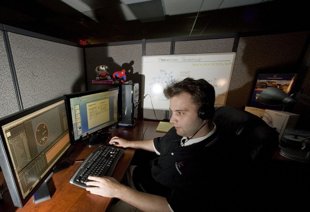 Ethron Young III, media designer for Convergence Training, works on a DVD authorization for environmental health and safety courses.