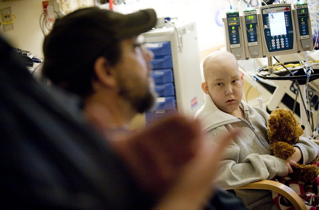 Photos by STEVEN LANE/The Columbian
Steven Fryberger, 12, of Orchards gets a visit from his family, including dad Dennis, at Doernbecher Children's Hospital in Portland. Steven has an acute form of leukemia and has been hospitalized off and on for 10 months. On Monday, his parents received a donated car so they can visit the hospital more frequently.