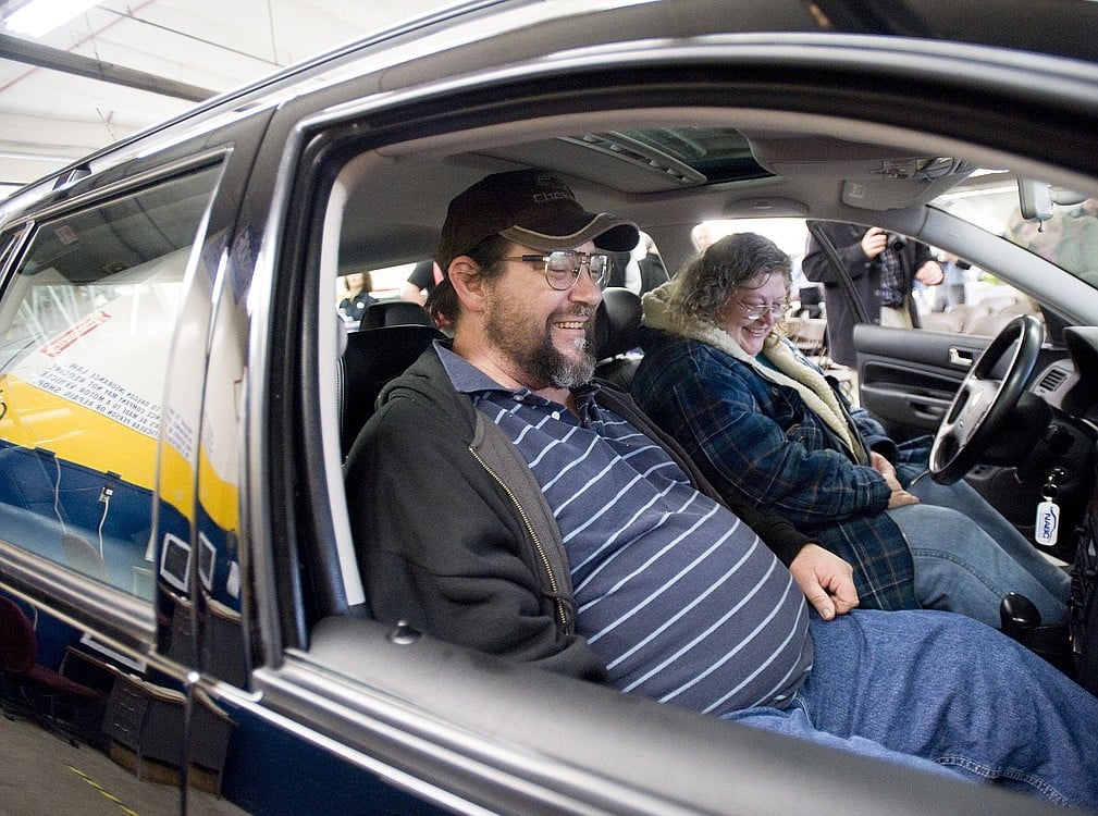 Dennis and Pamela Fryberger try out their refurbished 2005 Volkswagen Jetta station wagon, presented to them Monday. The car was donated to the family by Geico and Fix Auto Body as part of a national charitable program called Recycled Rides.