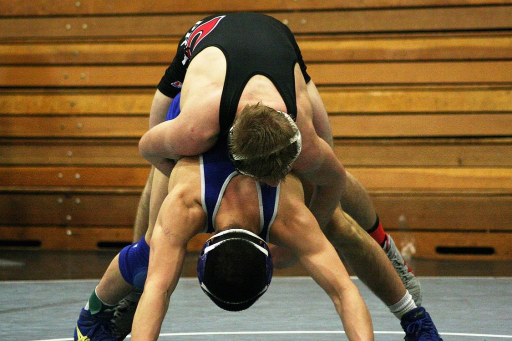 Bryant Elliott hangs on to Manny Mendez during the second round of the Pacific Coast Championships Friday, at Hudson's Bay High School. The Camas Papermaker beat his rival from Mountain View 5-4 and finished in fourth place. Talon Edmiston also took fourth place for Camas. Max Grimes and Rylan Thompson snagged seventh place, and Triston Groth earned eighth place.