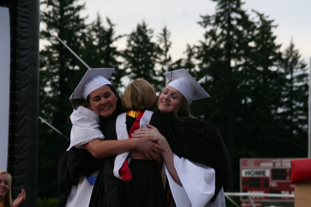 Post-Record file photo
Retiring teacher-librarian Rosemary Knapp gets a hug from CHS graduates Cassidy Hines (left) and Atalie Allen.