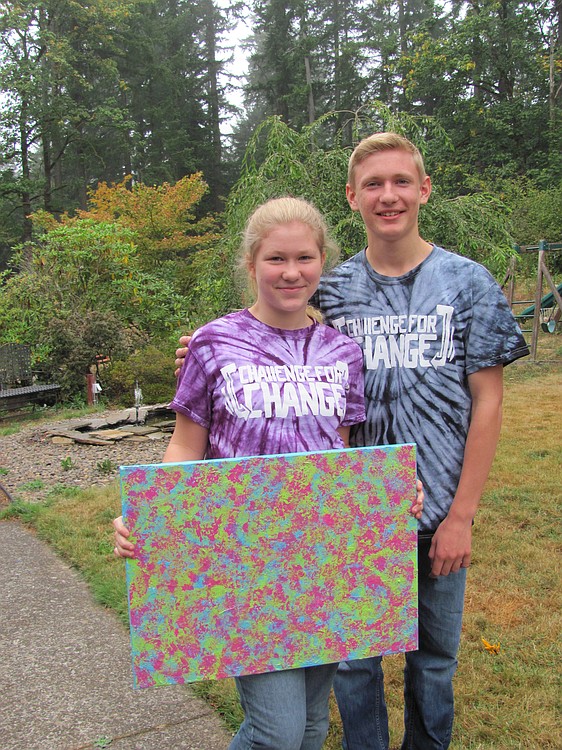 Post-Record file photo
Chloe and Carson Connors hold a painting she created, called "Hope," which was sold in a silent auction to raise money for the Teen Challenge Metro Men's Center. The two hosted a "Challenge for Change," event in honor of their brother, who overcame a heroin addiction.