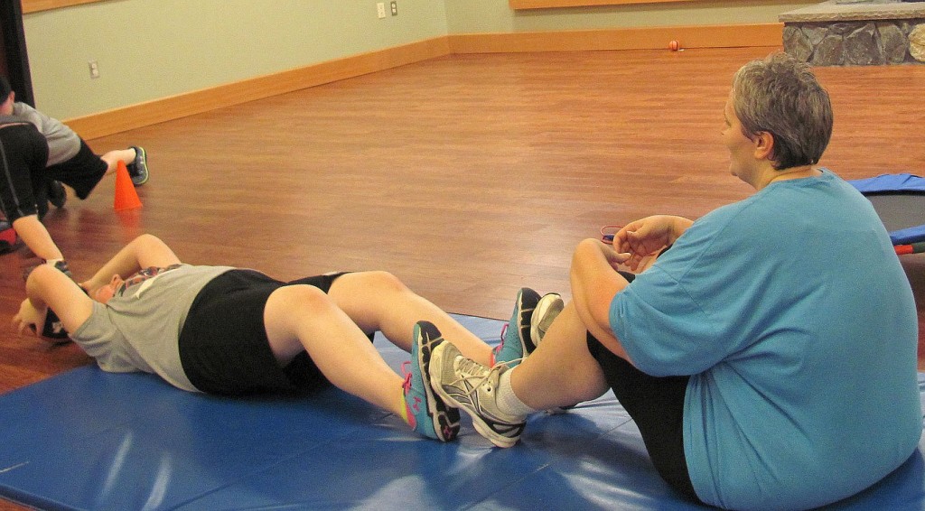 Denise and Paula Yeager work on an exercise to strengthen the abdominal muscles.