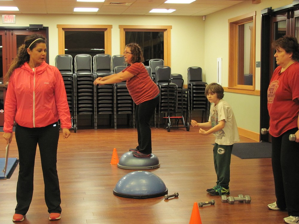 Anna Stephens demonstrates how to correctly do rows, which can help strengthen the back and triceps muscles.