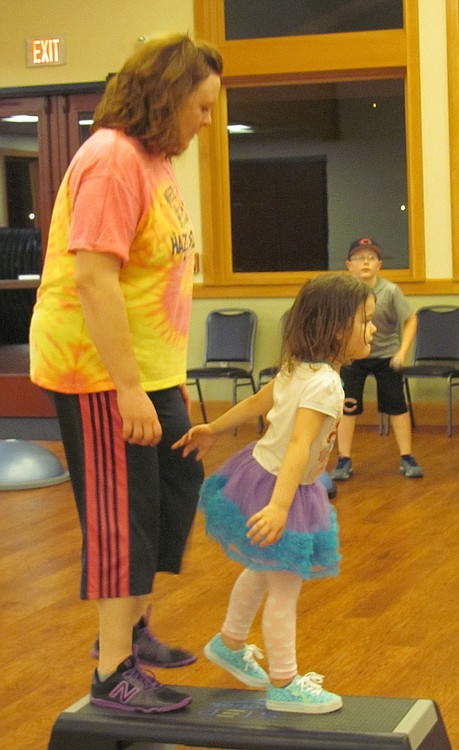 Tonia Wilmot works on leg strengthening exercises with her granddaughter, Jordyn, 2.