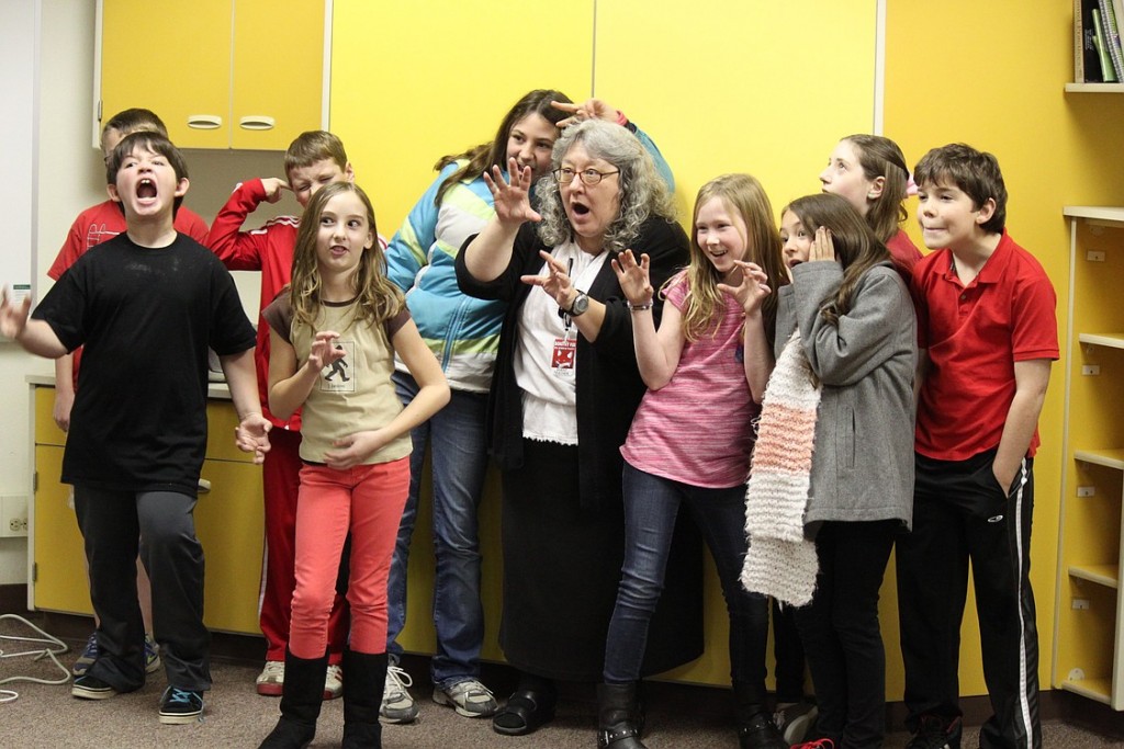 Halls makes scary faces with students who were invited to have lunch with the author Jan. 9 at Dorothy Fox Elementary School. Halls has written young adult books including "The Tales of the Cryptids," "Alien Investigation," In Search of Sasquatch," and "Saving the Baghdad Zoo."