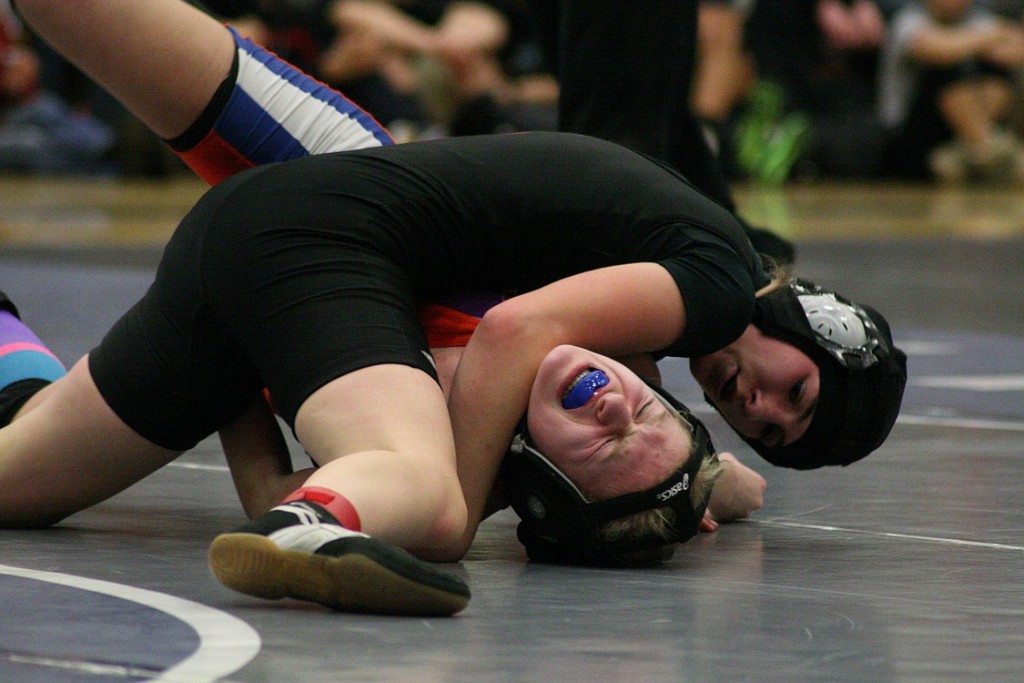 Camas High School junior Erin Tully latches on to Ridgefield's Baylee Wright and earns a pinfall victory for the 118-pound Clark County championship.