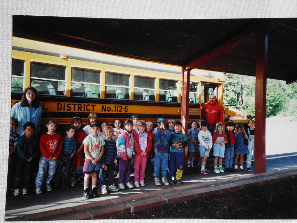 Broderick (far right) poses for a picture with Cape Horn-Skye Elementary School students he drove to and from school  in the mid-1990s.