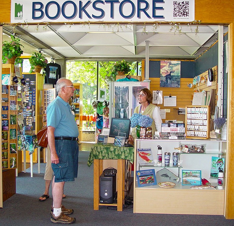 Volunteer Mary Delater lives on site during the summer and assists customers at the Bonneville Lock and Dam bookstore.