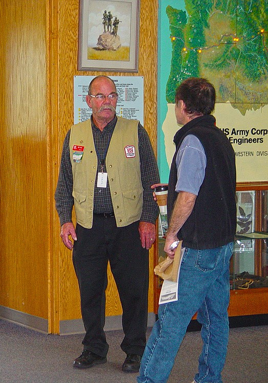 Bonneville Lock and Dam volunteer Ron Hile answers visitors' questions during his shift. Bonneville volunteers work with people from all over the world.