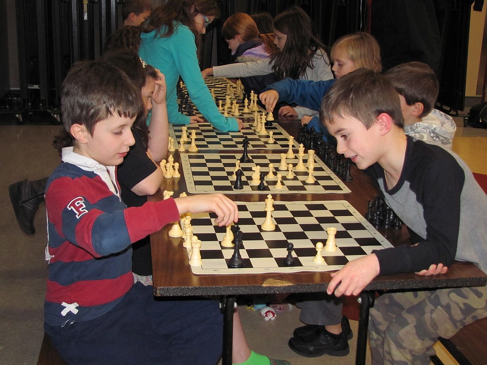 Students in the Success through Chess program at Dorothy Fox Elementary ponder their next moves during a recent practice.