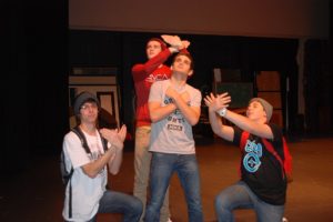 Washougal High School ASL students ham it up as they rehearse their rendition of the love song, "Some Say Love."  Pictured above, from left to right, are Austin Smith-Brown, Spencer Adams and Scott Nelson. Tanner Baldwin is in the center.