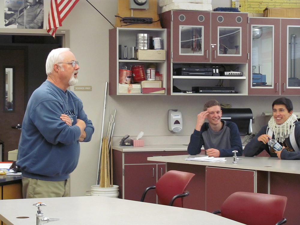 Croswell chats with his physics students about an upcoming final exam recently. "He's really good about explaining things based on real world experience," noted Kyle Binder, a senior.