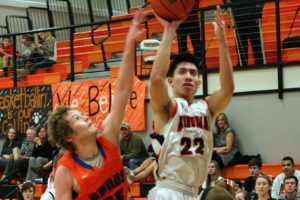 Austin Tran nets two of his 27 points for the Panthers Jan. 28, at Washougal High School. The Panthers beat Ridgefield 62-48.