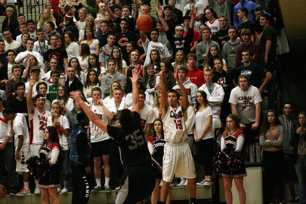 Camas fans cheer on a 3-point attempt by Kantas Zalpys Friday. The Union boys escaped the warehouse with a 57-51 victory.