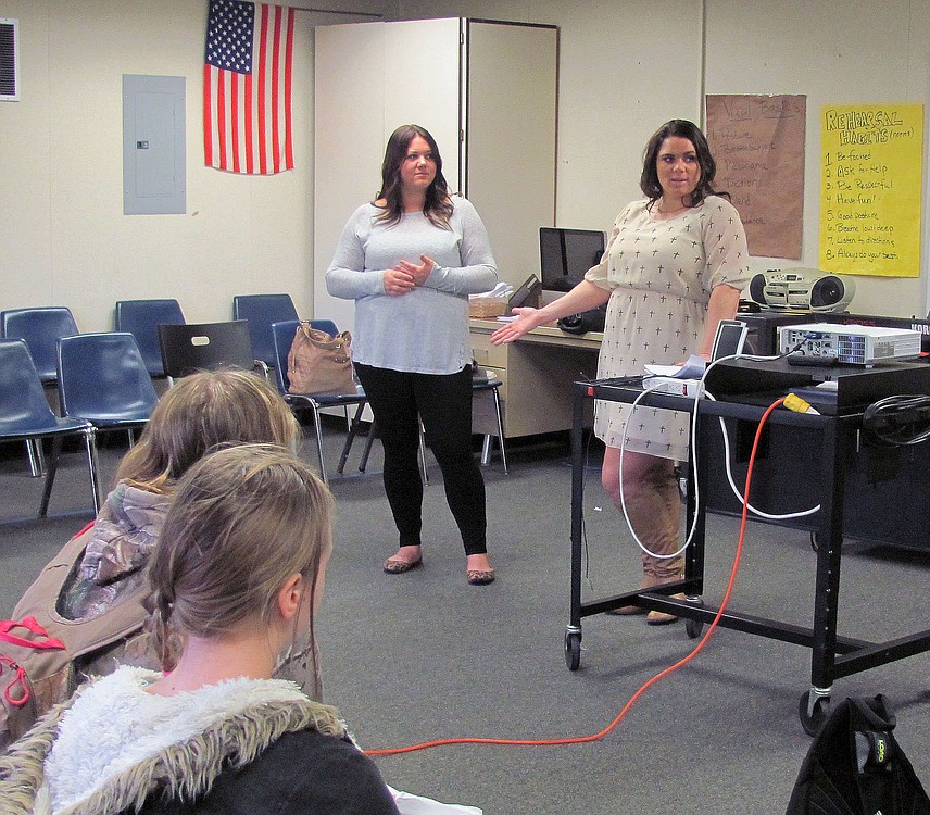 Jemtegaard Middle School students listen to Katie Lewis, (right)nail technician, and Kimberly Syfrett, hair stylist, talk about the benefits of a career in cosmetology. Lewis owns Beauty Temptations salon in Washougal.