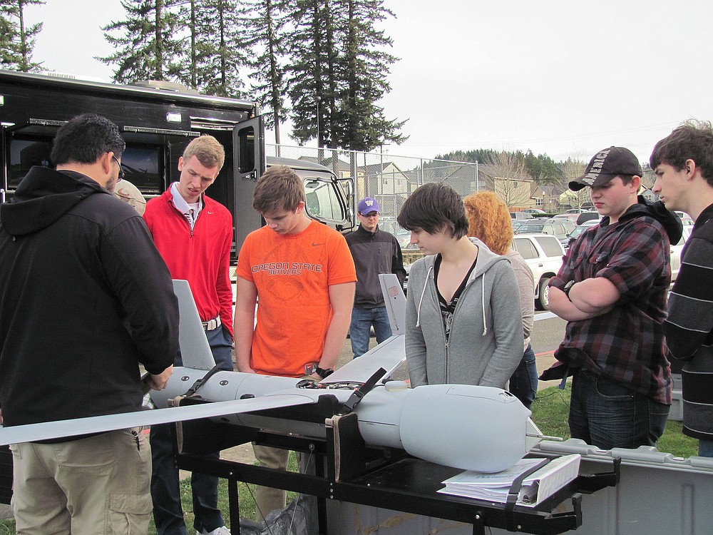Bronson Ignacio, an employee with Insitu, educates students about drones and unmanned aircraft during career day at Washougal High School.