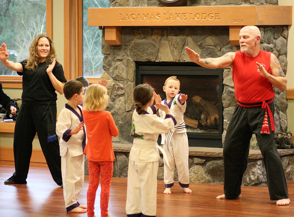 Amy Brevick and Sifu Paco teach preschool students basic kung fu techniques. Paco teaches in the "kajukenbo" style.