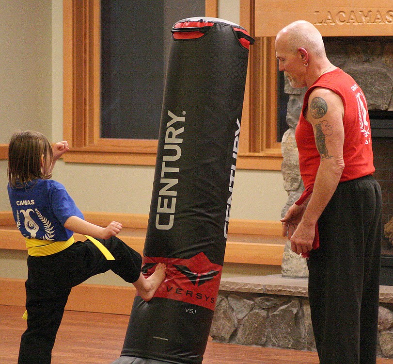 Paco said Kung Fu can help teach self-control, discipline, patience and respect. Here, a student practices a kick.