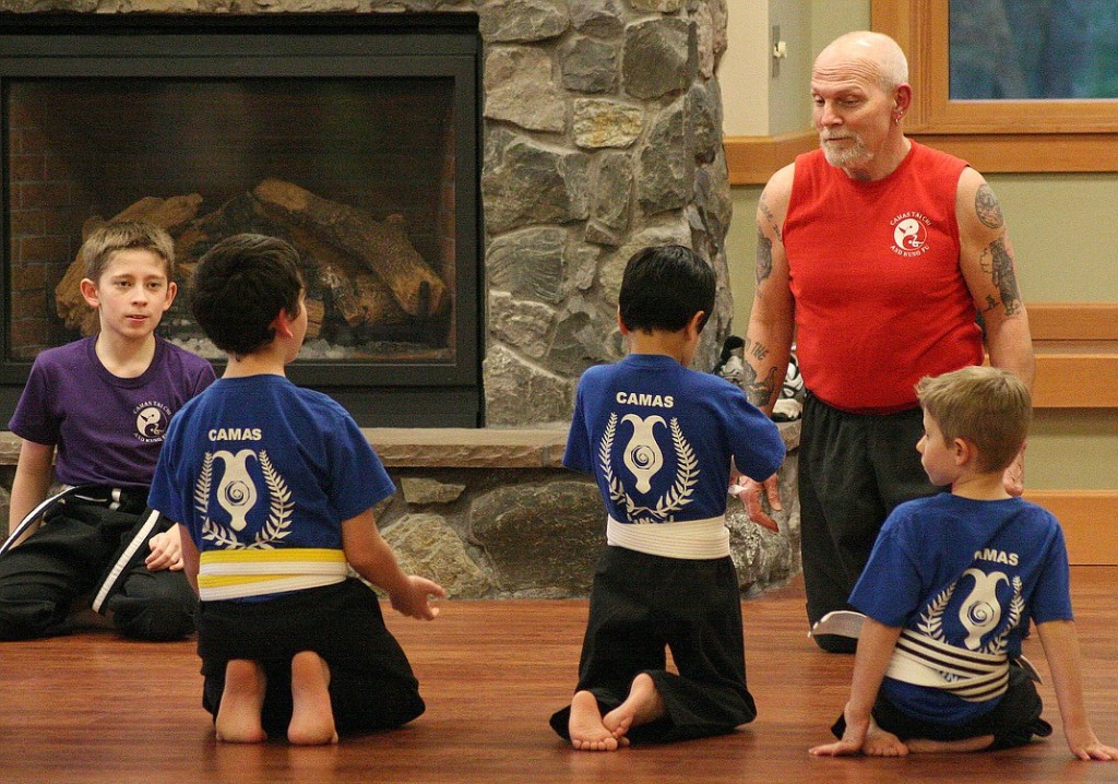 Paco and student Zach Ager give instructions to the Kung Fu class. Ager began taking classes with Paco seven years ago and now helps assist him. He is a junior black belt.