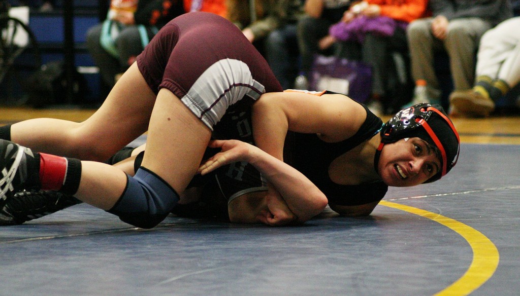 Washougal junior Yaneli Martinez pins Hoquiam sophomore Bree Hyder to win the 100-pound regional girls championship Saturday, at Kelso High School.