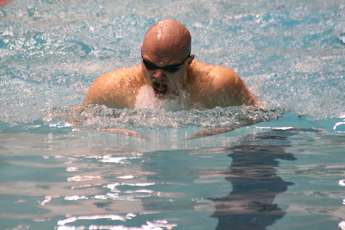 Jake Yraceburu breaking a minute in the 100 breaststroke.
