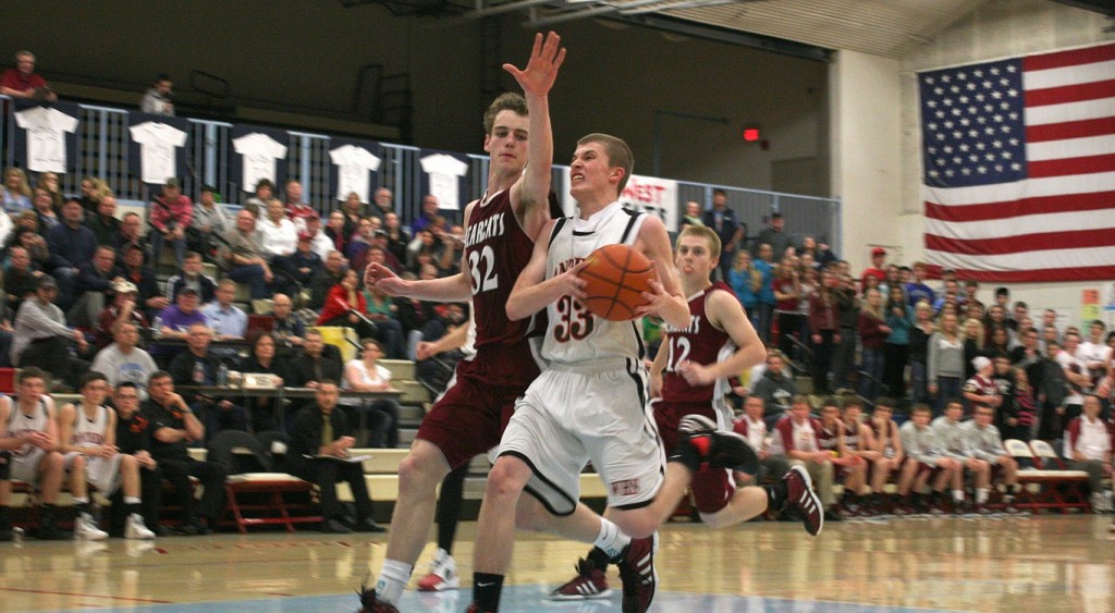 Jaden Jantzer (33) glides to the hoop for two of his 12 points off the bench for the Panthers in the district playoffs Saturday, at Mark Morris High School. He also hit two big 3-pointers in the game.