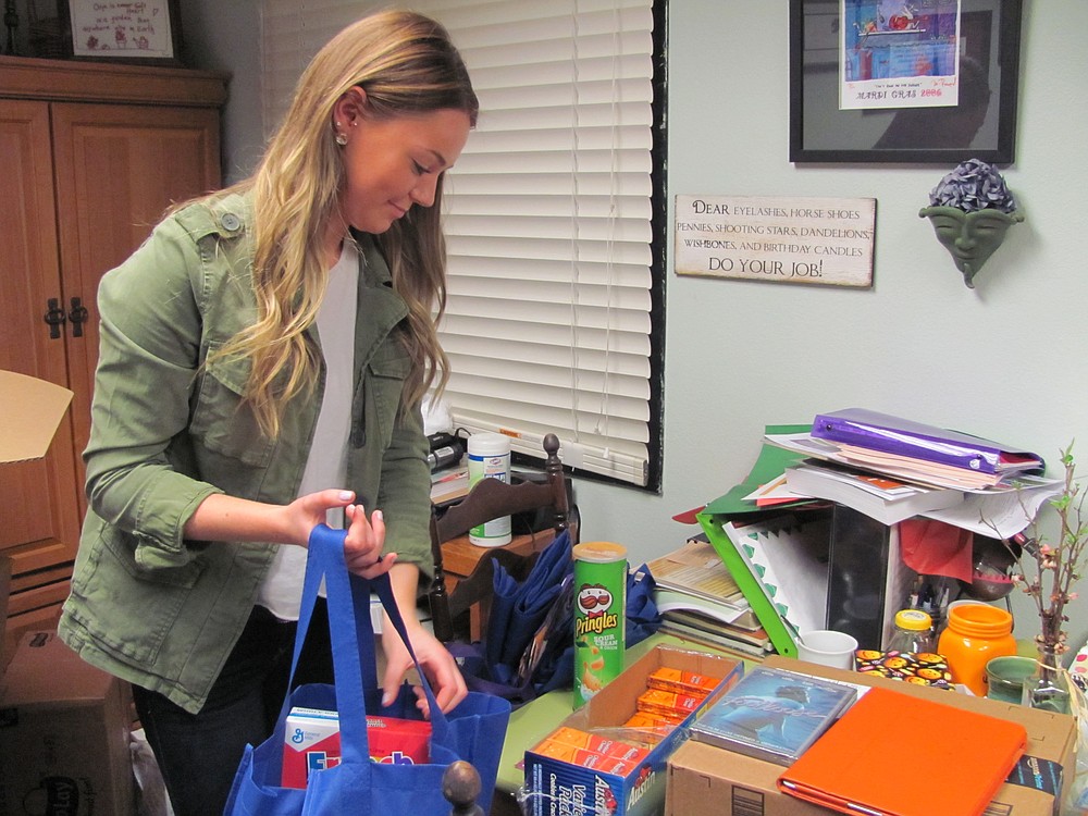 Mackenzie Kitchen assembles one of the 20 food bags she puts together every week as a part of her senior project.