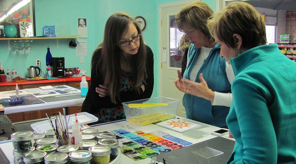 Studio13 GlassArt owner Shirley Bishop (center) explains safety precautions to Ruth Bosckis (left) and Anne Marie Standley before a recent class.