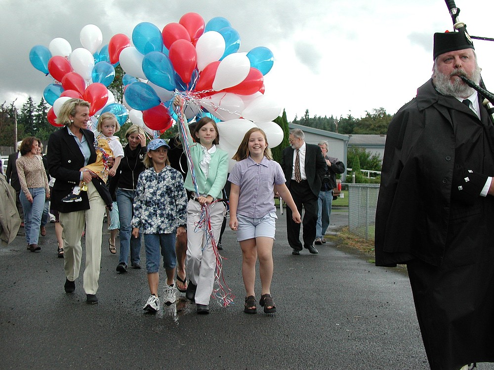 A ground breaking ceremony for the future Jack, Will and Rob Youth Center was held in Camas in June 2001. The event was attended by several members of the boys' family including their mother Geri Pope Bidwell (far left) and their sister, Lucy Bidwell (holding balloons). Jack, Will and Rob Warren died in November 1999 with their father William "Tiger" Warren when their small plane crashed into the Columbia River. The youth center opened in October 2002, and this year marks its 10th anniversary.