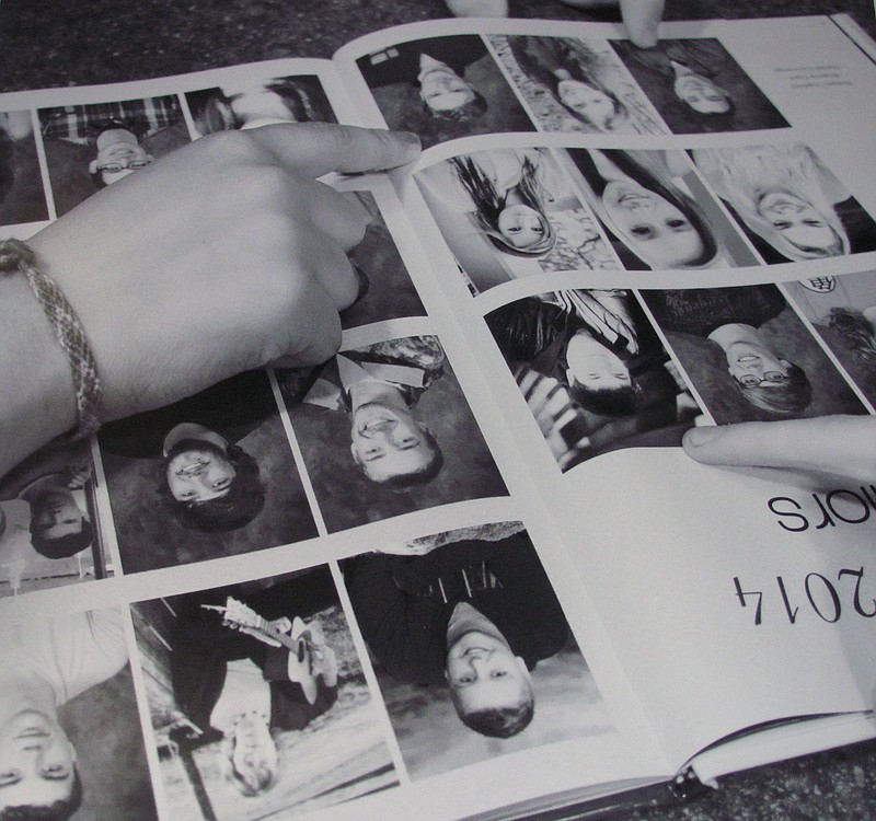 Peter de Lory photographed events and daily activities that he felt best illustrated Hayes Freedom, such as the gestures students' hands made as they looked at a yearbook.