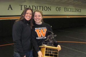 Erin Locke (right) shares a proud moment with coach Heather Carver (left). Locke became the first female to win Washougal High School Wrestling's Ultimate Ironman award.